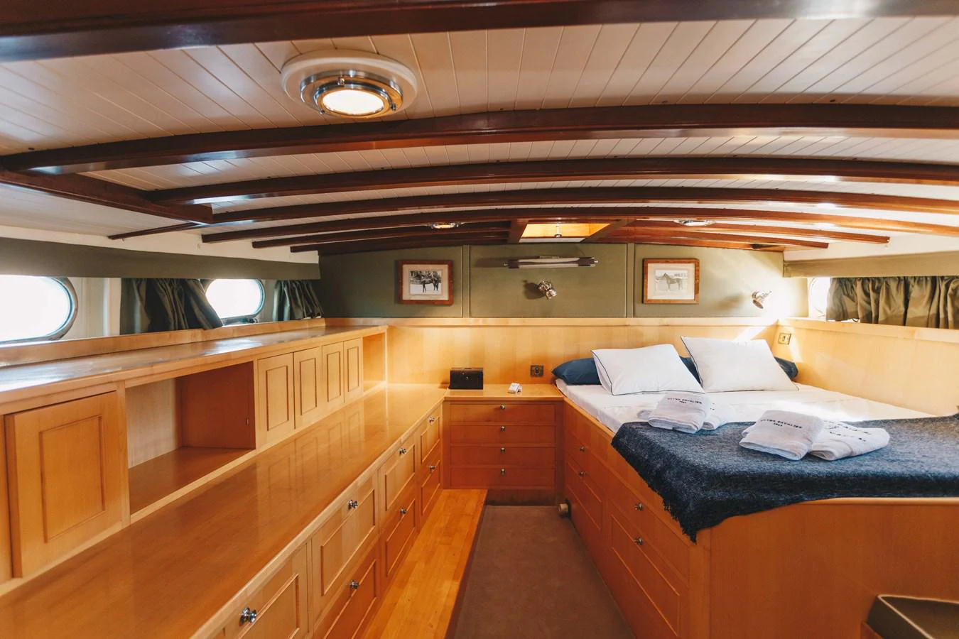 a room with a bed and a desk aboard SILVER CAVALIER Yacht for Sale