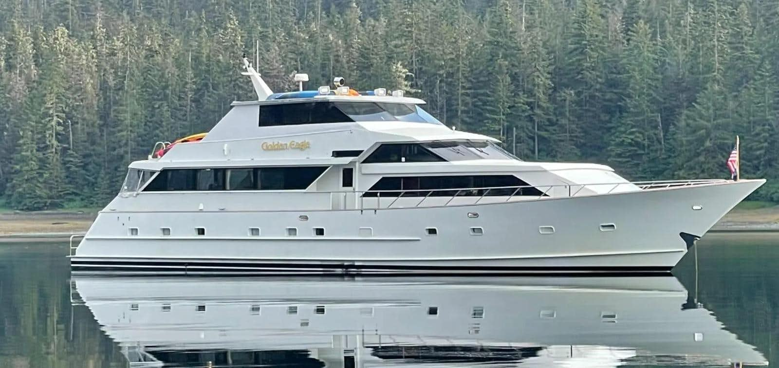 a white yacht on a lake aboard GOLDEN EAGLE Yacht for Sale