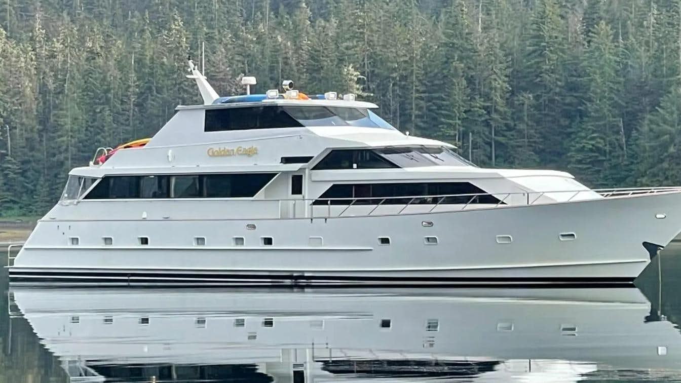 a white yacht on a lake aboard GOLDEN EAGLE Yacht for Sale