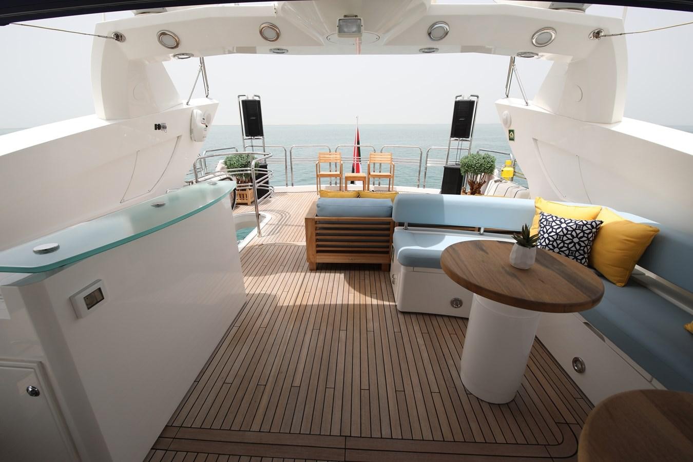 a white yacht with a table and chairs on a deck aboard 2008 SUNSEEKER 90 Yacht for Sale