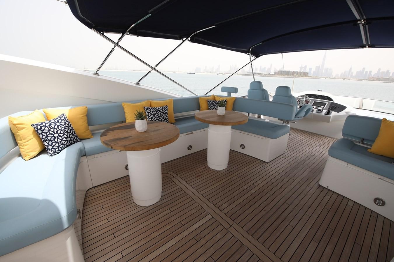 a lounge area with a couch and a table with chairs aboard 2008 SUNSEEKER 90 Yacht for Sale