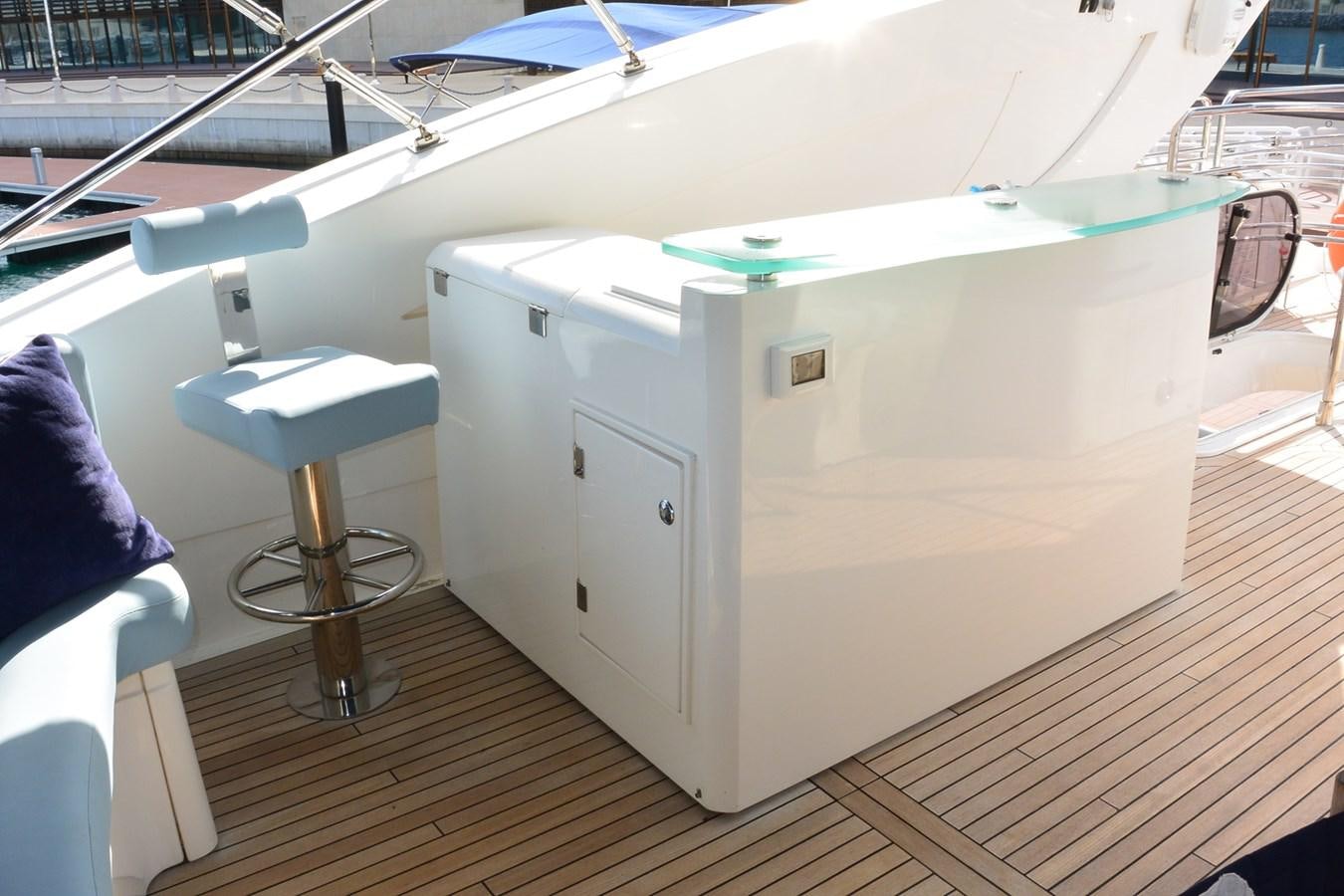 a white boat on a deck aboard 2008 SUNSEEKER 90 Yacht for Sale