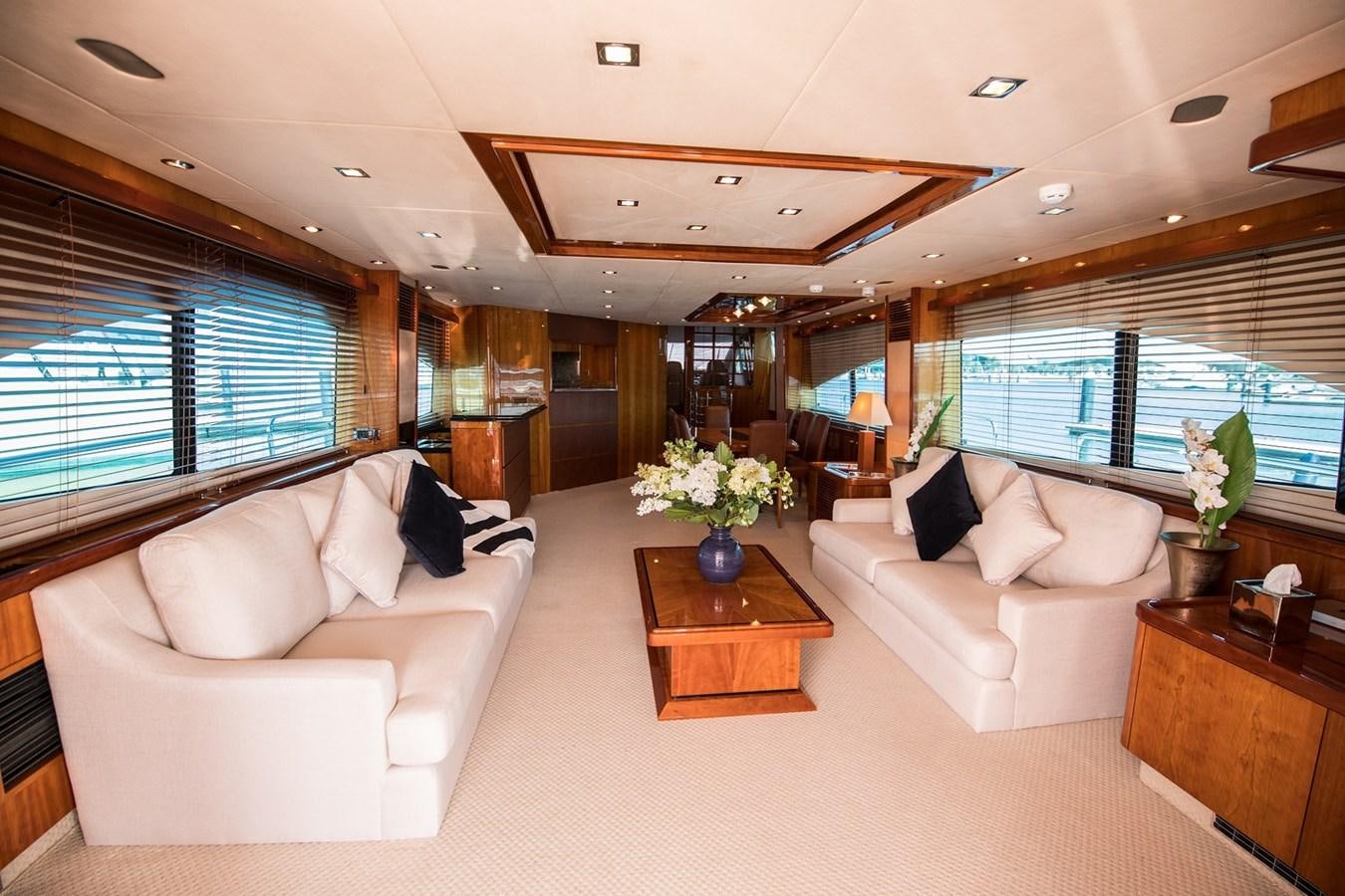 a living room with a large window aboard 2008 SUNSEEKER 90 Yacht for Sale