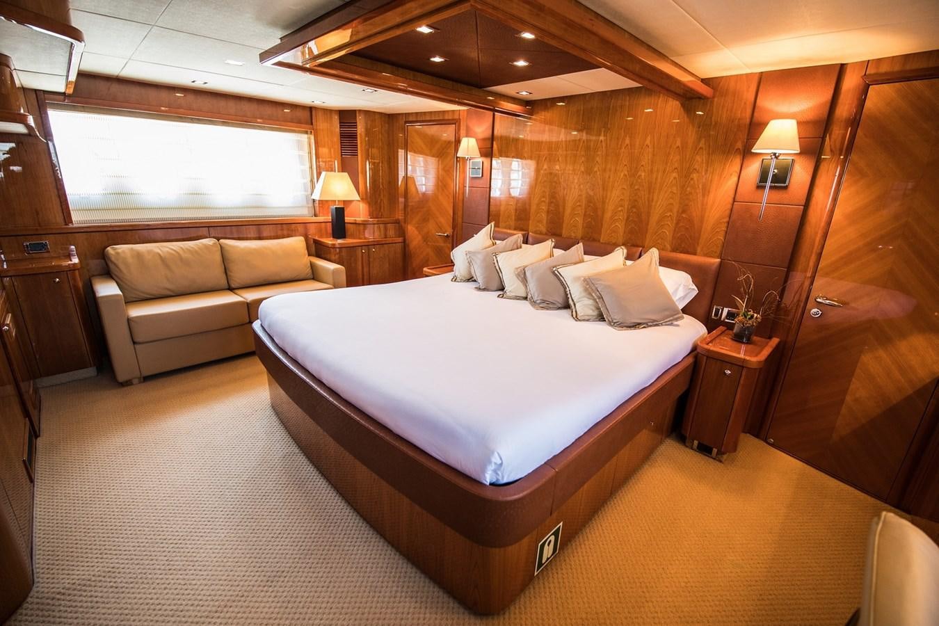 a large bed in a room aboard 2008 SUNSEEKER 90 Yacht for Sale