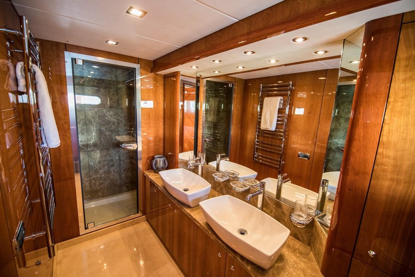 a bathroom with a large mirror aboard 2008 SUNSEEKER 90 Yacht for Sale