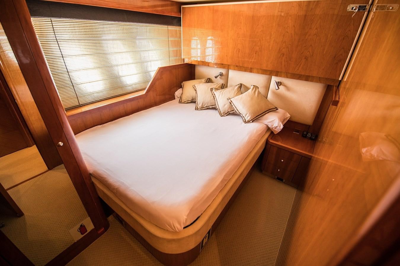 a bed in a room aboard 2008 SUNSEEKER 90 Yacht for Sale