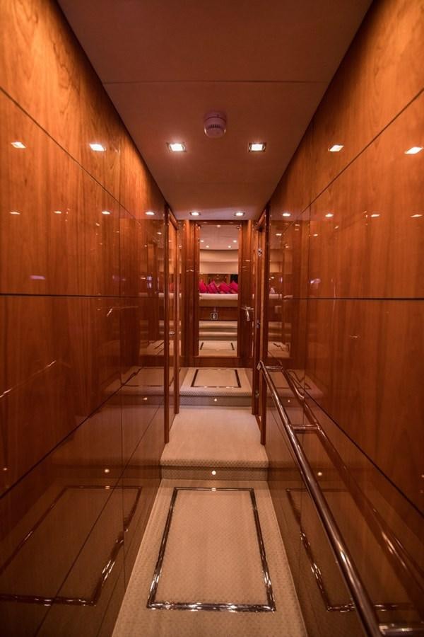 a wood hallway with a glass door aboard 2008 SUNSEEKER 90 Yacht for Sale