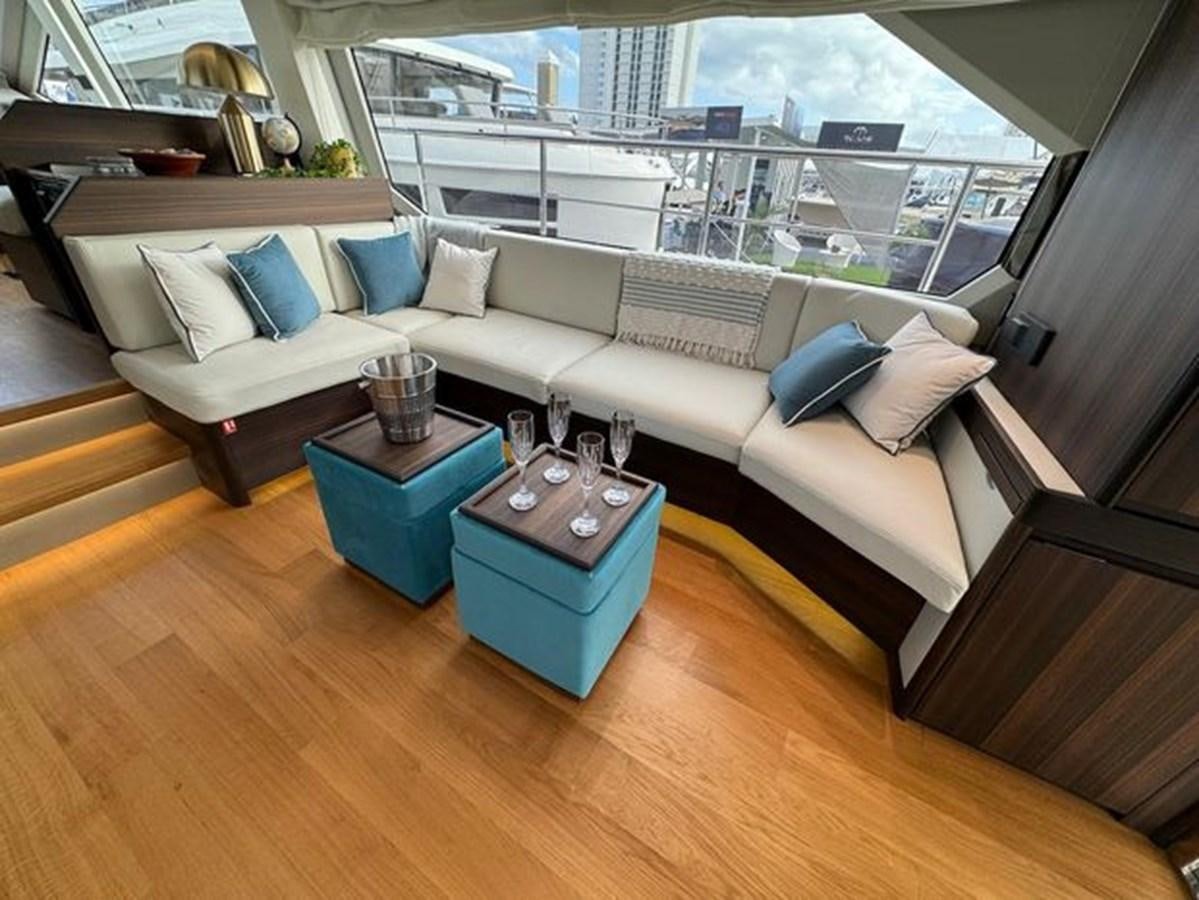 a living room with a couch and a coffee table aboard AICON 66 VIVERE Yacht for Sale