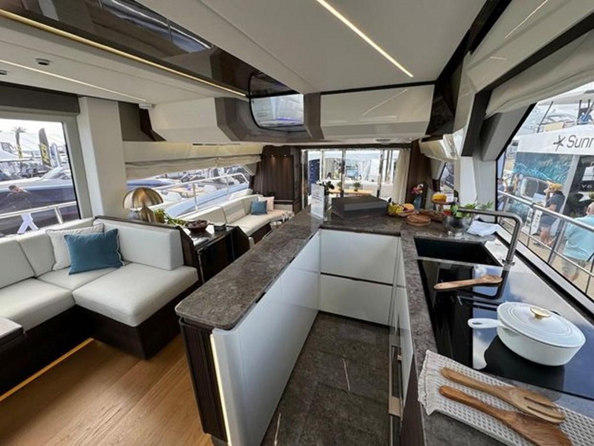 a kitchen with a large window aboard AICON 66 VIVERE Yacht for Sale