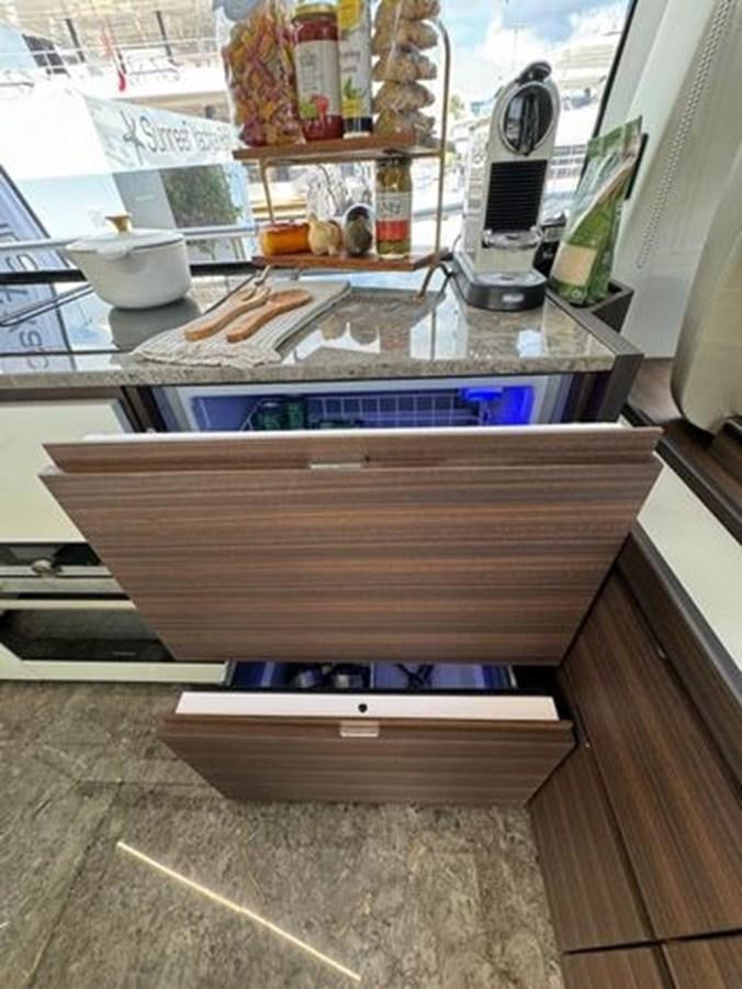 a kitchen counter with a stove and oven aboard AICON 66 VIVERE Yacht for Sale