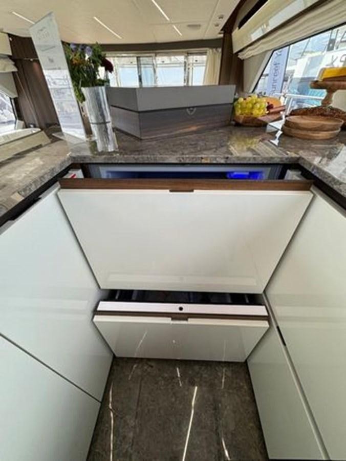 a kitchen with a large white counter aboard AICON 66 VIVERE Yacht for Sale