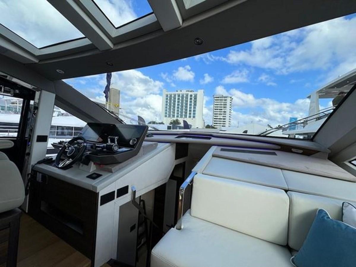 a room with a view of a city and a large window aboard AICON 66 VIVERE Yacht for Sale