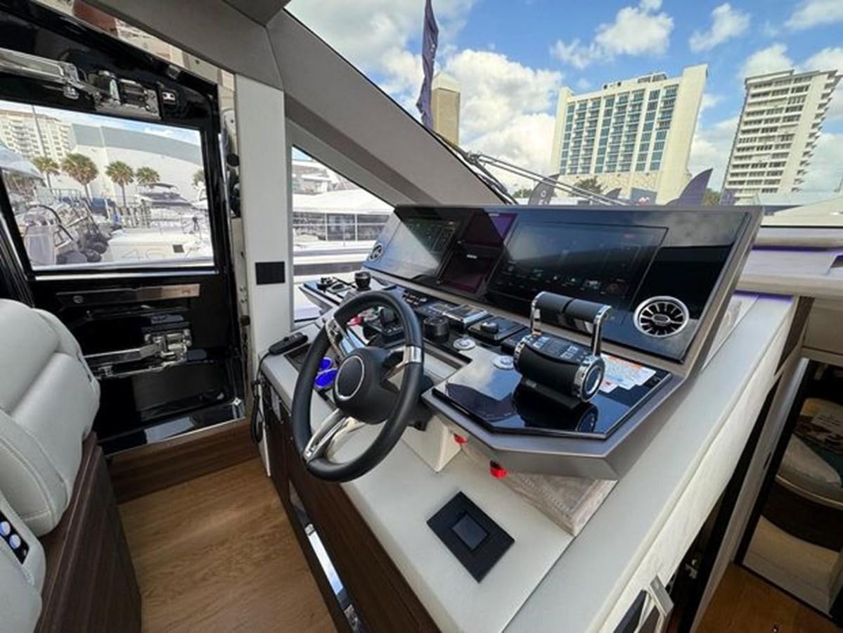 a room with a large window and a view of a city aboard AICON 66 VIVERE Yacht for Sale