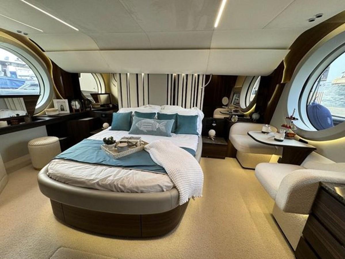 a bedroom with a bed and a large mirror aboard AICON 66 VIVERE Yacht for Sale
