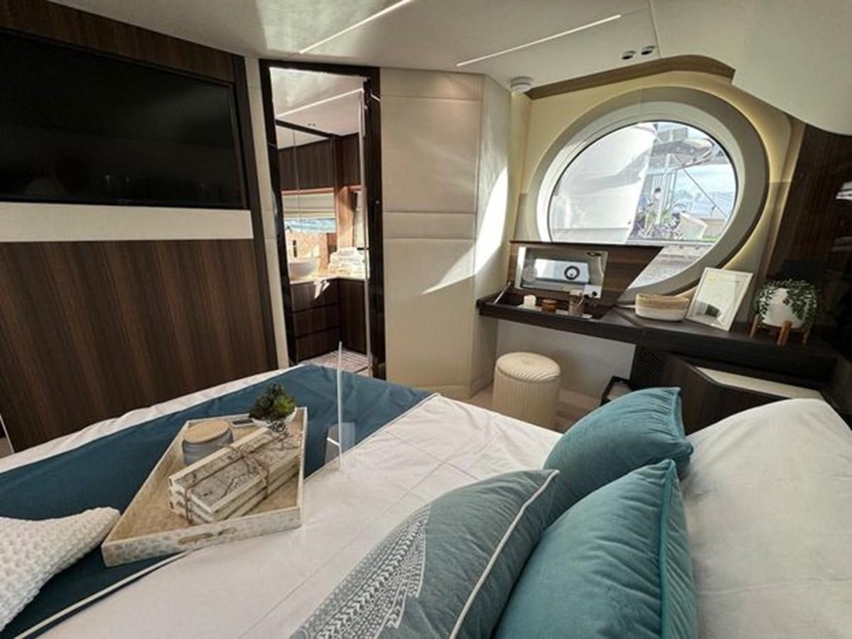 a room with a bed and a mirror aboard AICON 66 VIVERE Yacht for Sale