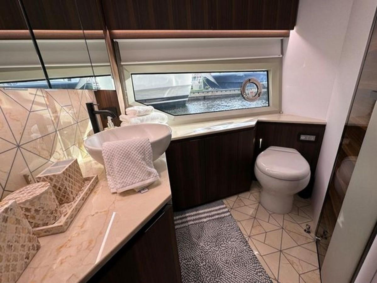 a bathroom with a sink and toilet aboard AICON 66 VIVERE Yacht for Sale
