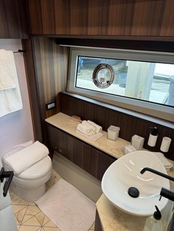 a bathroom with a sink and toilet aboard AICON 66 VIVERE Yacht for Sale