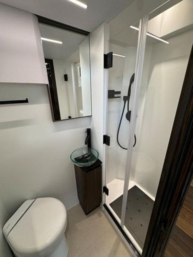 a bathroom with a stand up shower aboard AICON 66 VIVERE Yacht for Sale