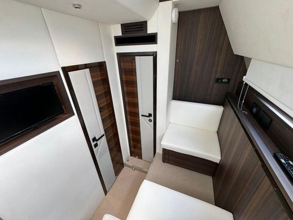 a small room with a bed and a couch aboard AICON 66 VIVERE Yacht for Sale