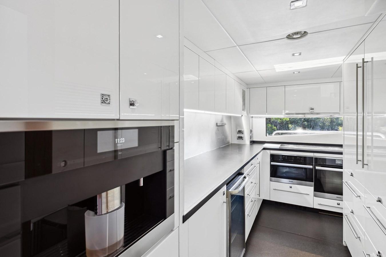 a kitchen with white cabinets aboard SEAHORSE Yacht for Sale