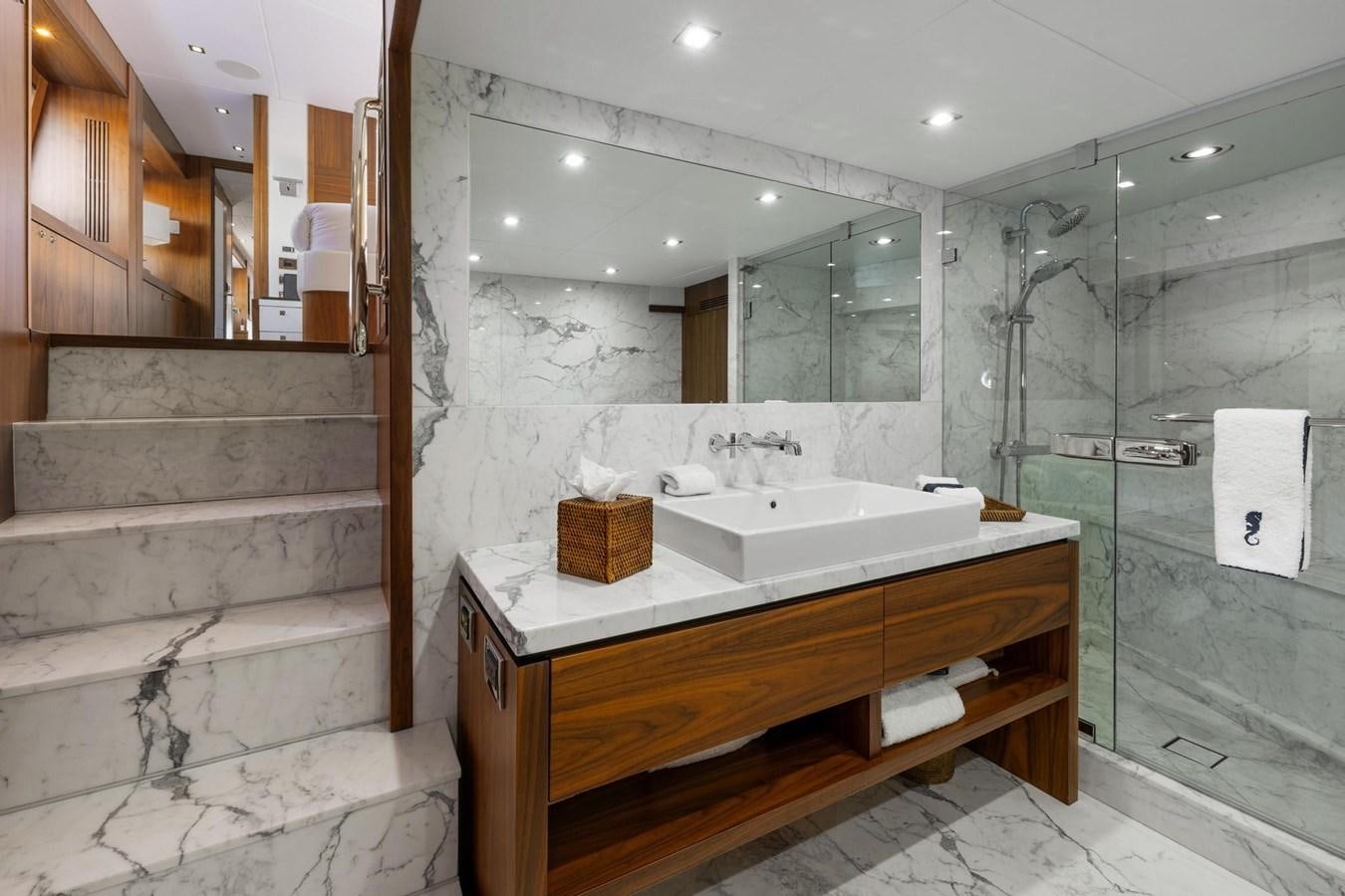 a bathroom with a sink and a mirror aboard SEAHORSE Yacht for Sale