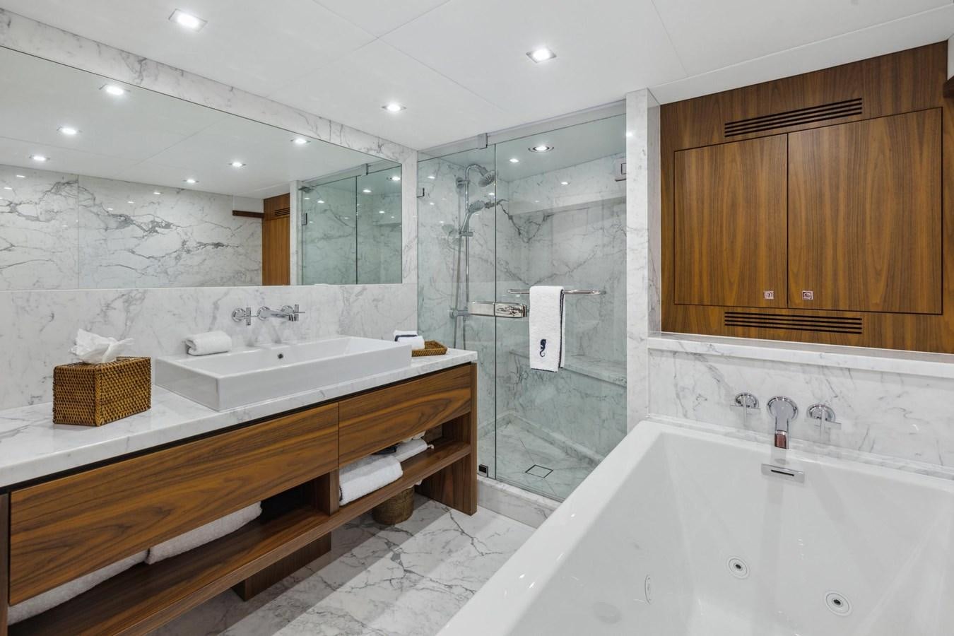 a bathroom with a tub sink and a shower aboard SEAHORSE Yacht for Sale