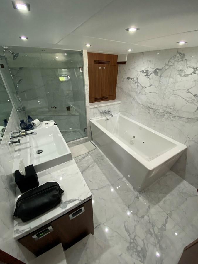 a bathroom with a bathtub and sink aboard SEAHORSE Yacht for Sale