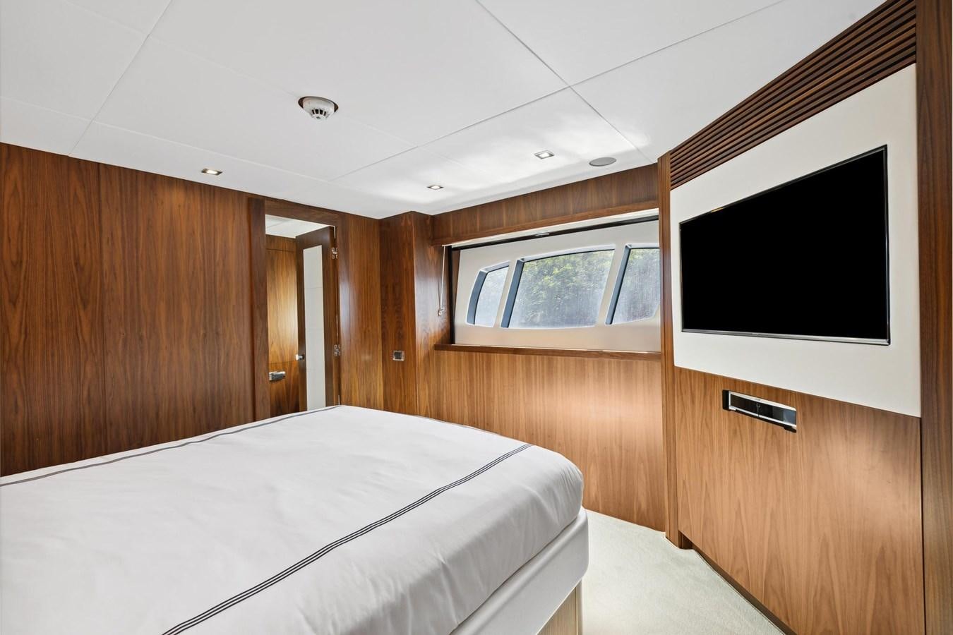a room with a bed and a television aboard SEAHORSE Yacht for Sale