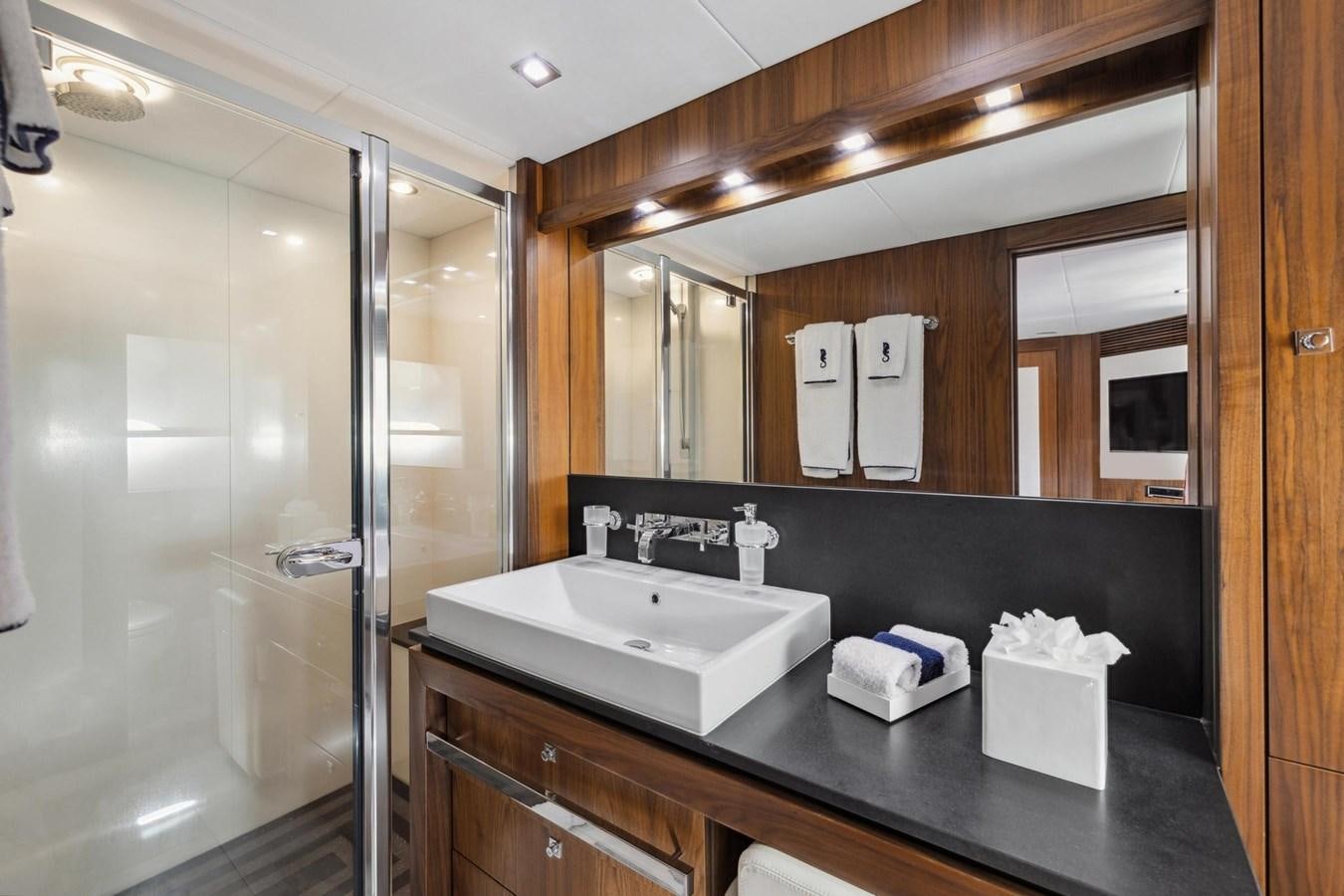 a bathroom with a glass shower aboard SEAHORSE Yacht for Sale