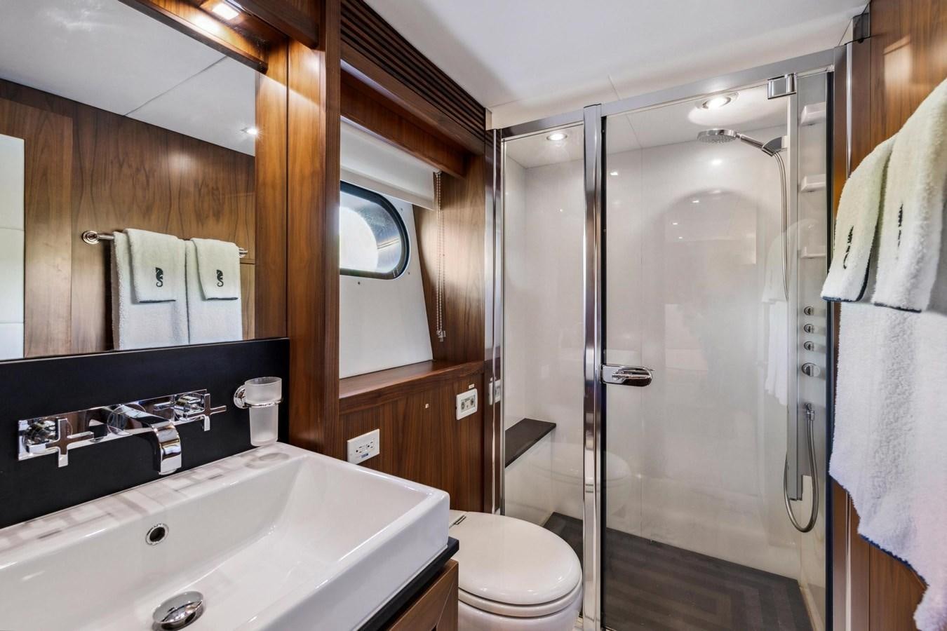 a bathroom with a sink toilet and a shower unit aboard SEAHORSE Yacht for Sale