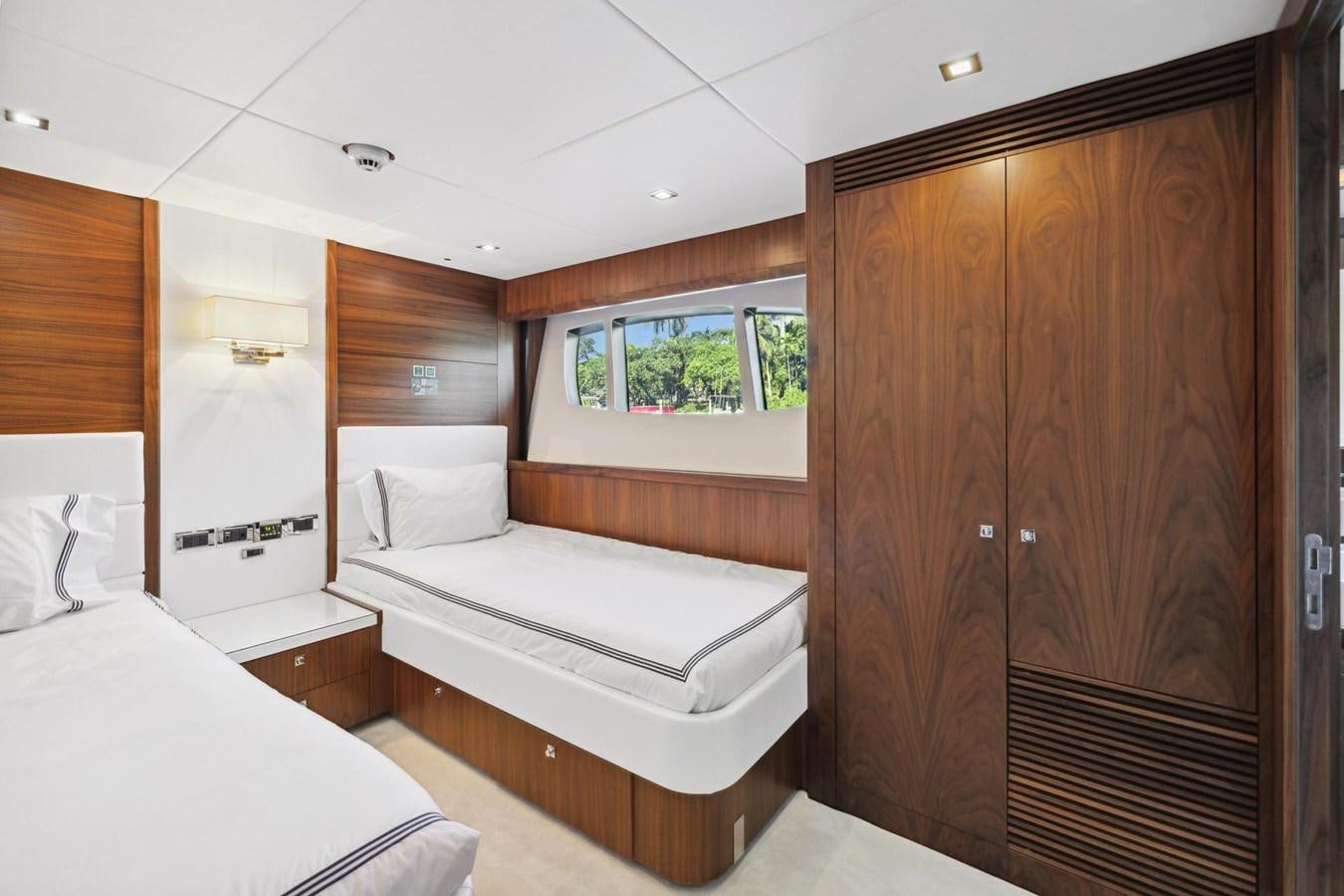 a room with a bed and a closet aboard SEAHORSE Yacht for Sale