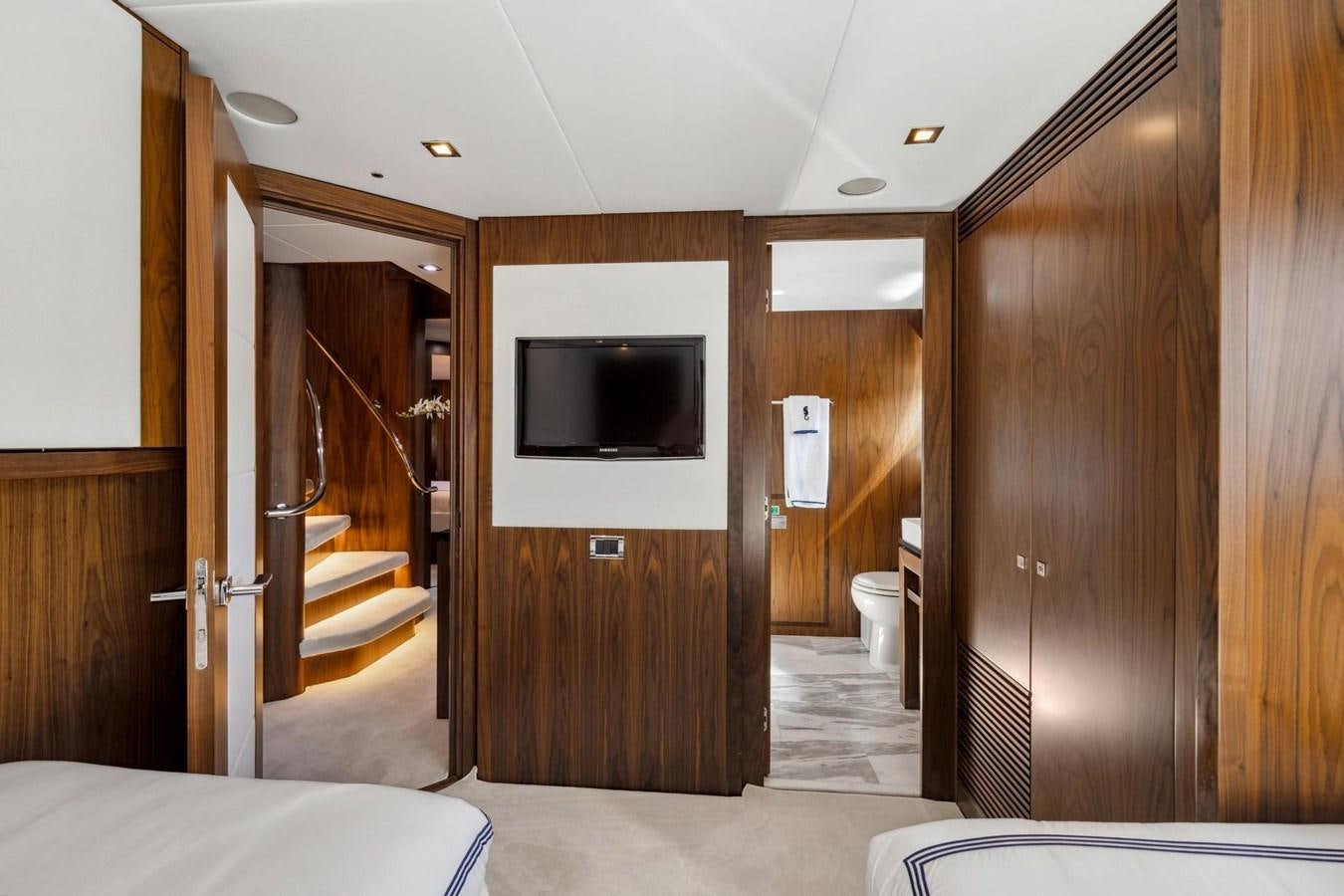 a room with a bed and a television aboard SEAHORSE Yacht for Sale