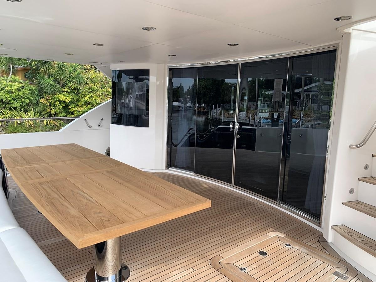 a large wooden table in a room aboard SEAHORSE Yacht for Sale