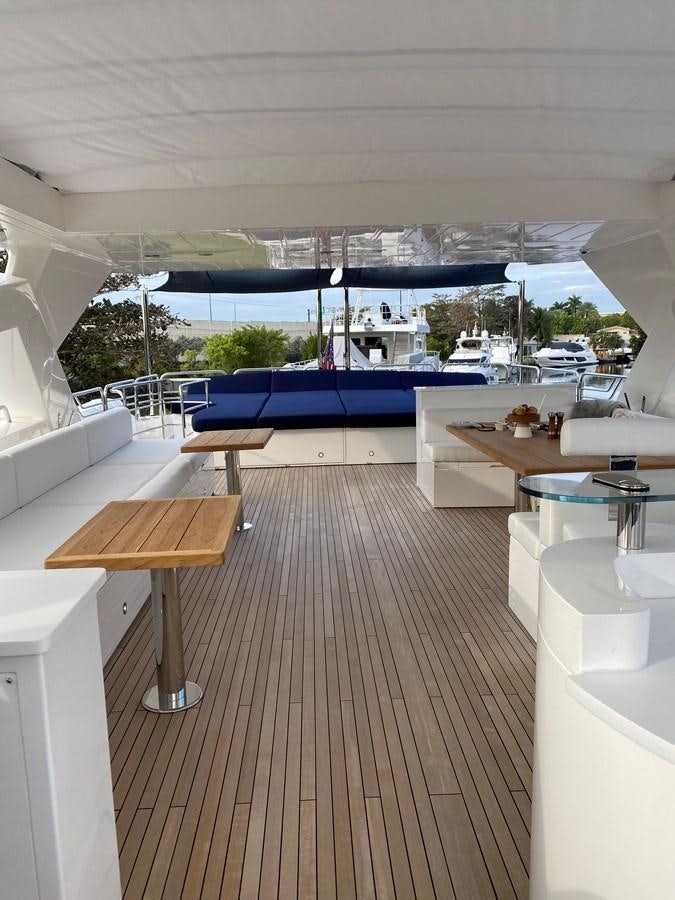 a room with a pool and a deck with a deck and a deck aboard SEAHORSE Yacht for Sale