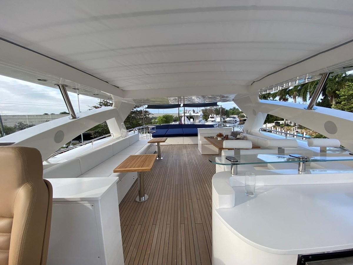 a room with a wood floor and white walls and a wood bench aboard SEAHORSE Yacht for Sale