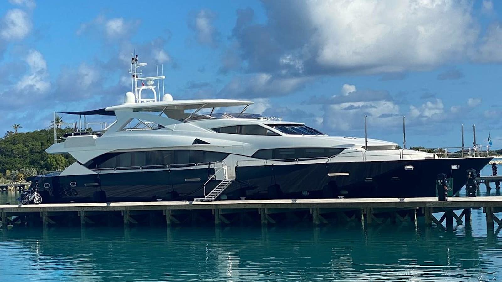a large yacht docked at a dock aboard SEAHORSE Yacht for Sale