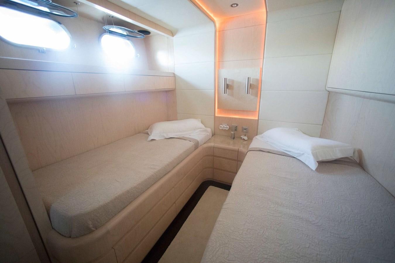 a room with two beds aboard PRINCESS L Yacht for Sale