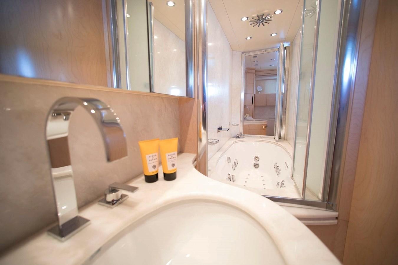 a bathroom with a bathtub and a sink aboard PRINCESS L Yacht for Sale
