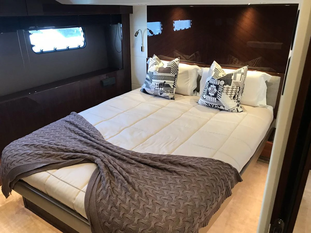 a bed with pillows aboard ANIKO Yacht for Sale