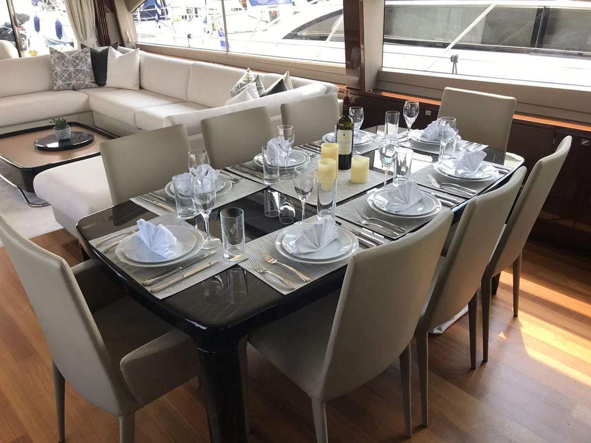 a table set with wine glasses aboard ANIKO Yacht for Sale