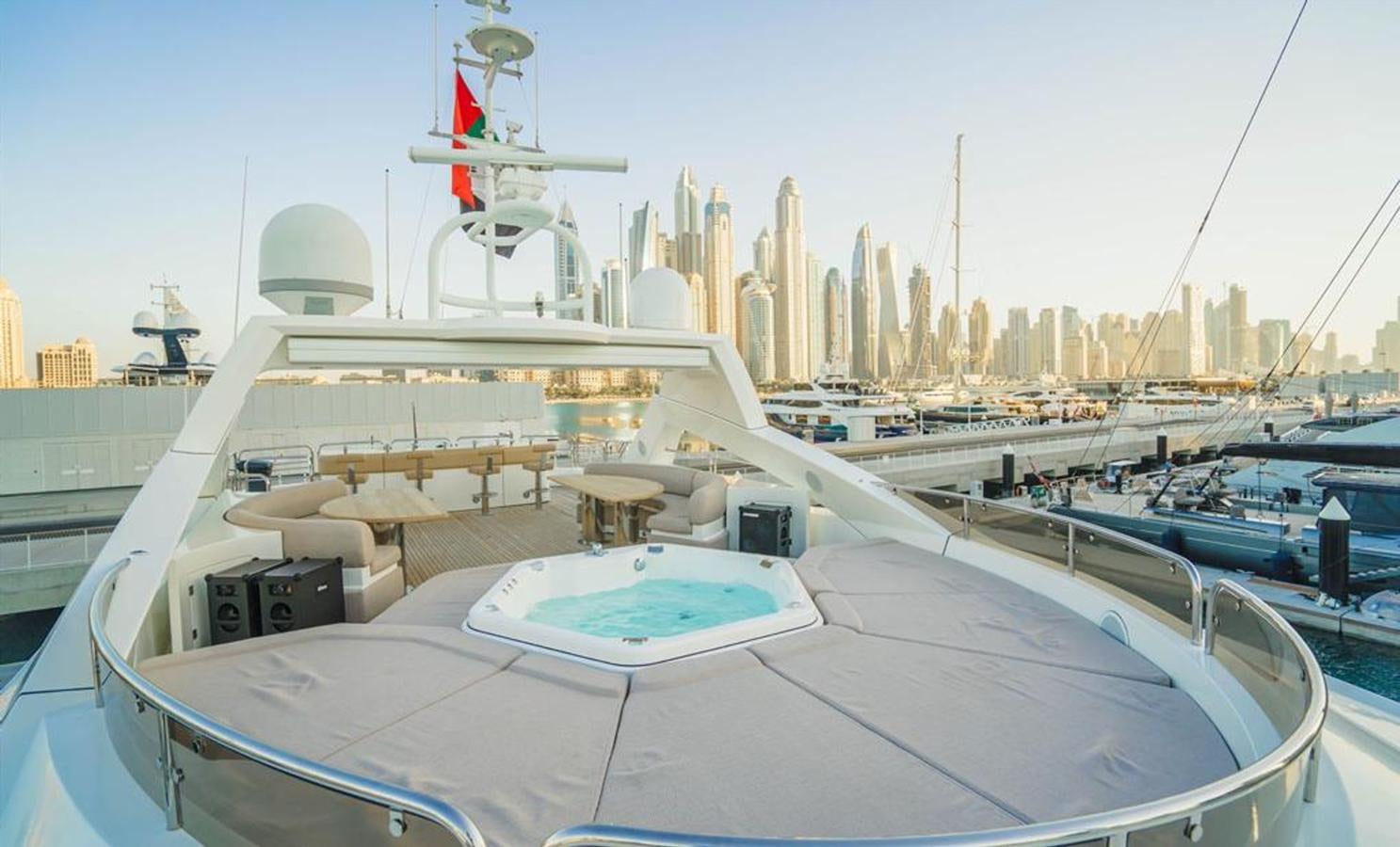 a large white boat with a city in the background aboard 2010 SUNSEEKER 40M Yacht for Sale