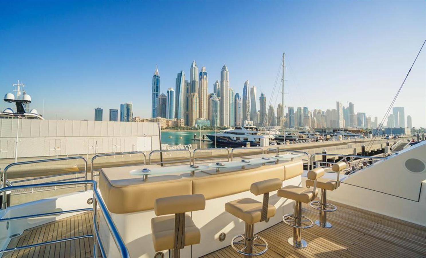a deck with a view of a city and a large body of water aboard 2010 SUNSEEKER 40M Yacht for Sale