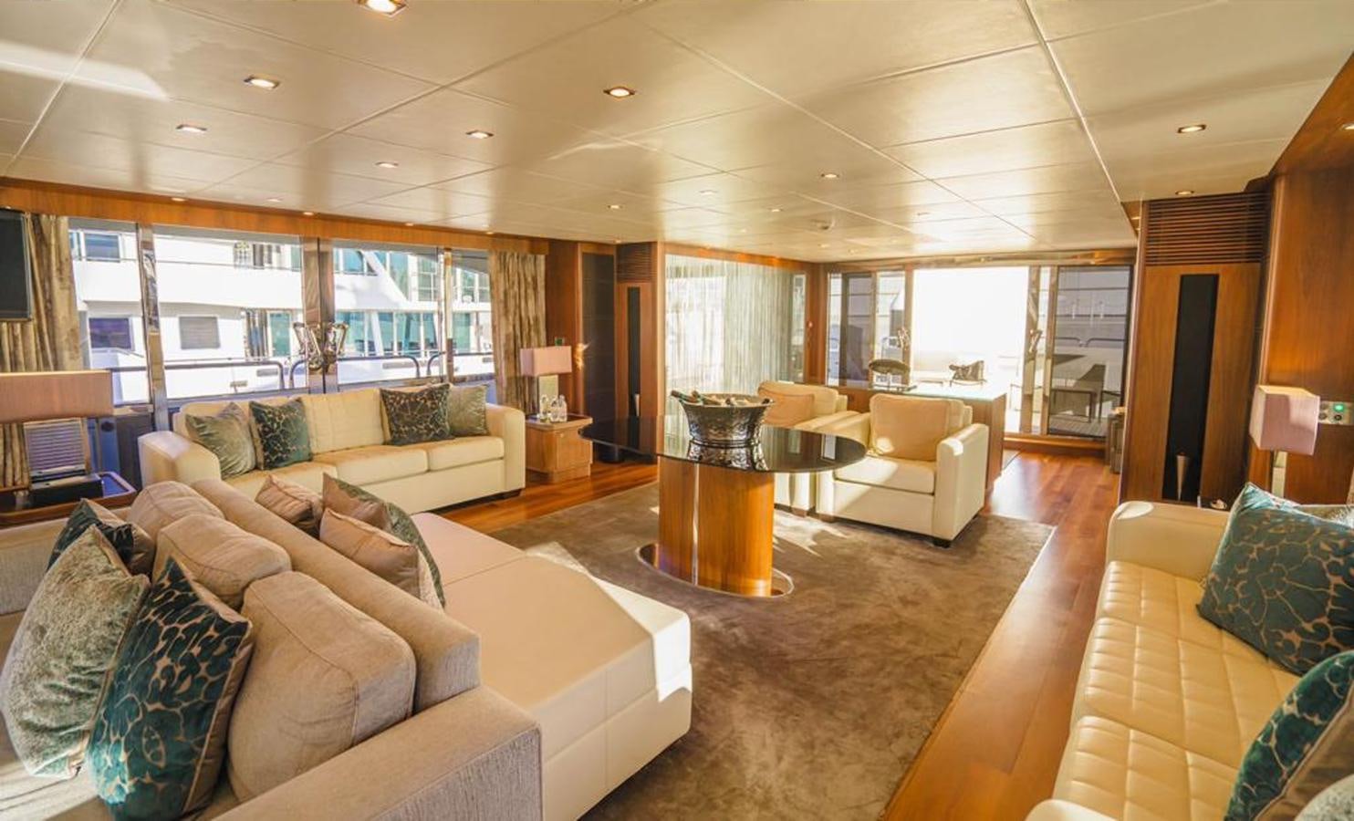 a living room with a large window aboard 2010 SUNSEEKER 40M Yacht for Sale
