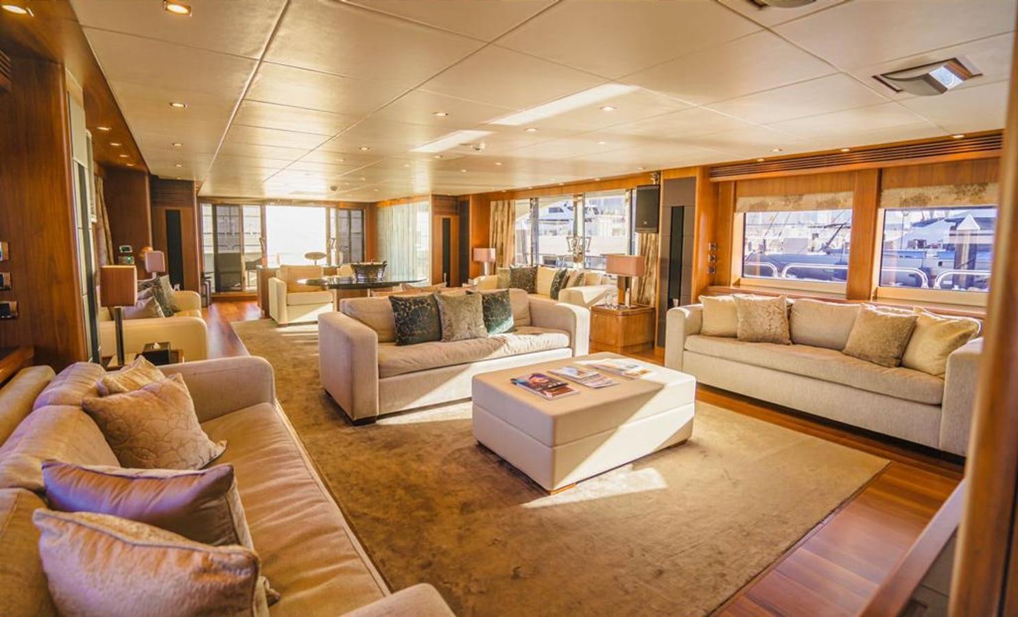 a living room with a couch and a coffee table aboard 2010 SUNSEEKER 40M Yacht for Sale