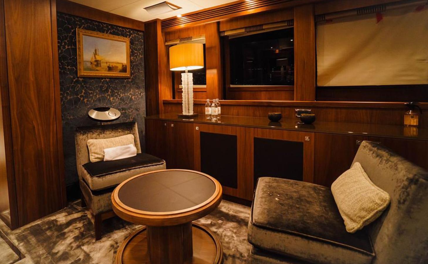 a room with a couch and a table aboard 2010 SUNSEEKER 40M Yacht for Sale