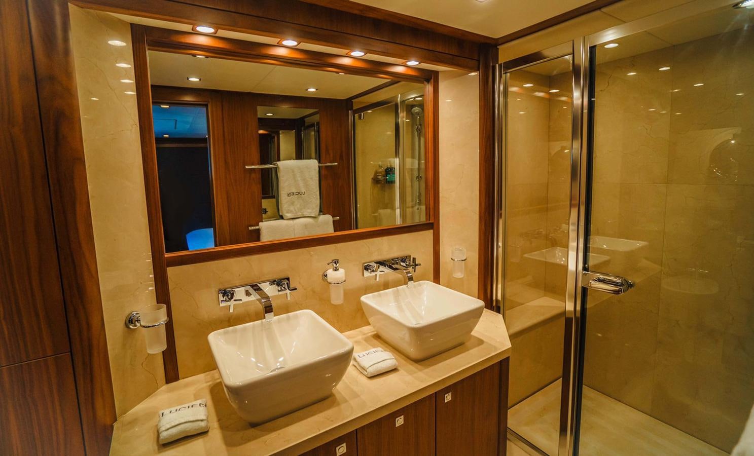 a bathroom with a large mirror aboard 2010 SUNSEEKER 40M Yacht for Sale