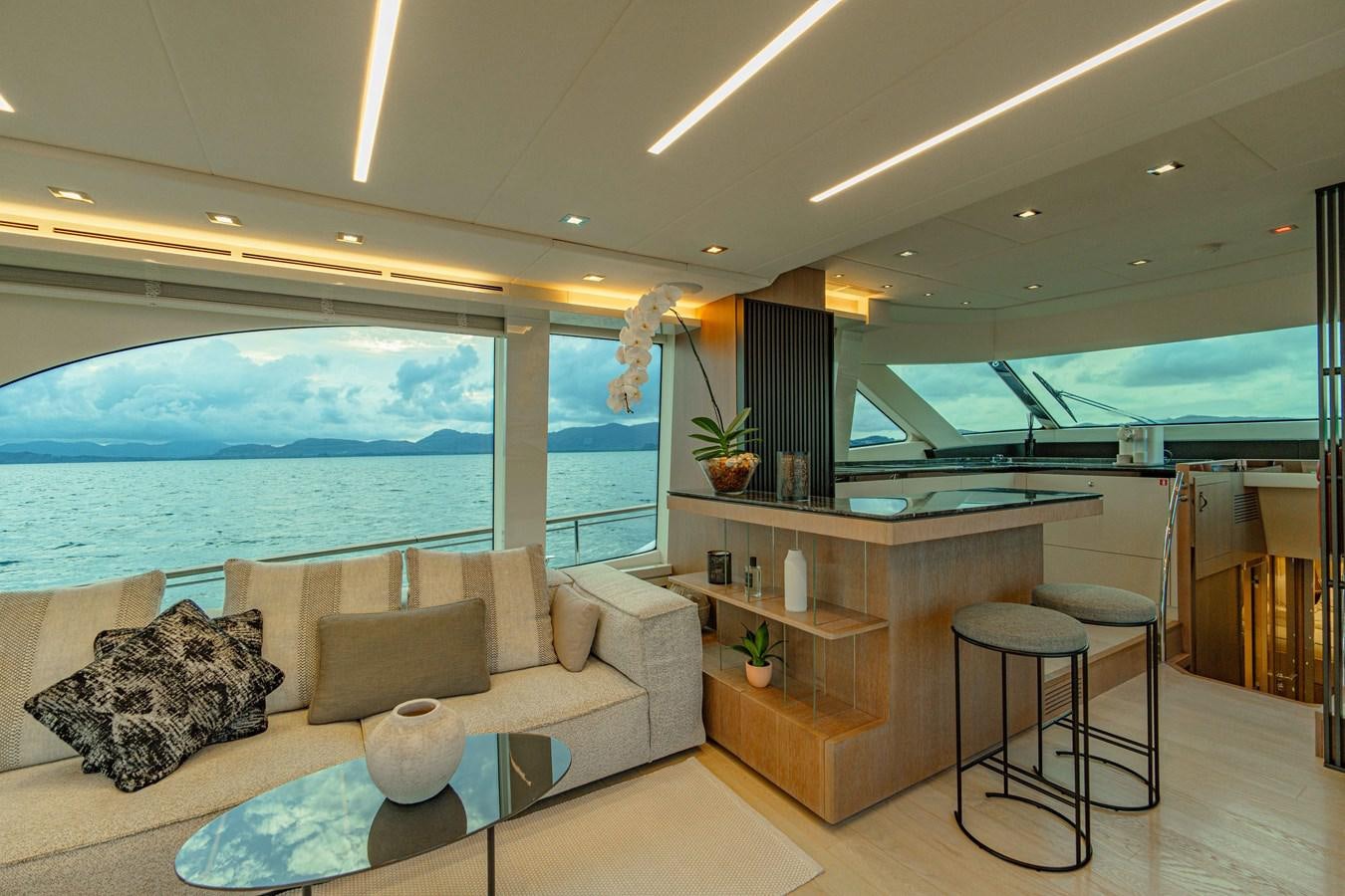 a living room with a large window aboard ILLUZION Yacht for Sale