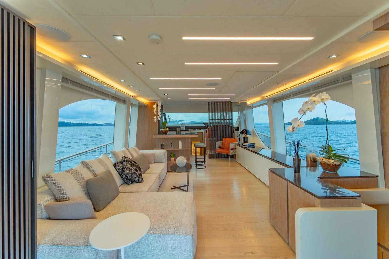 a living room with a large window aboard ILLUZION Yacht for Sale