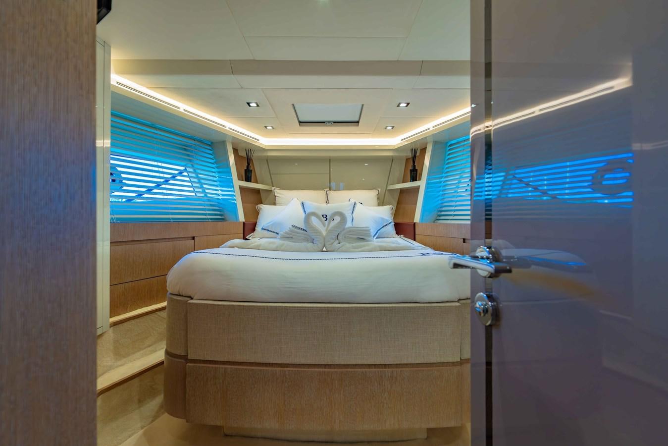 a bed in a room aboard ILLUZION Yacht for Sale
