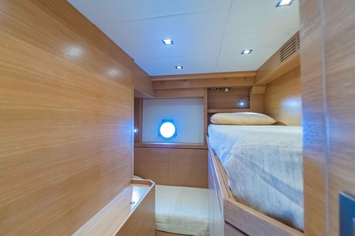 a room with bunk beds aboard ILLUZION Yacht for Sale